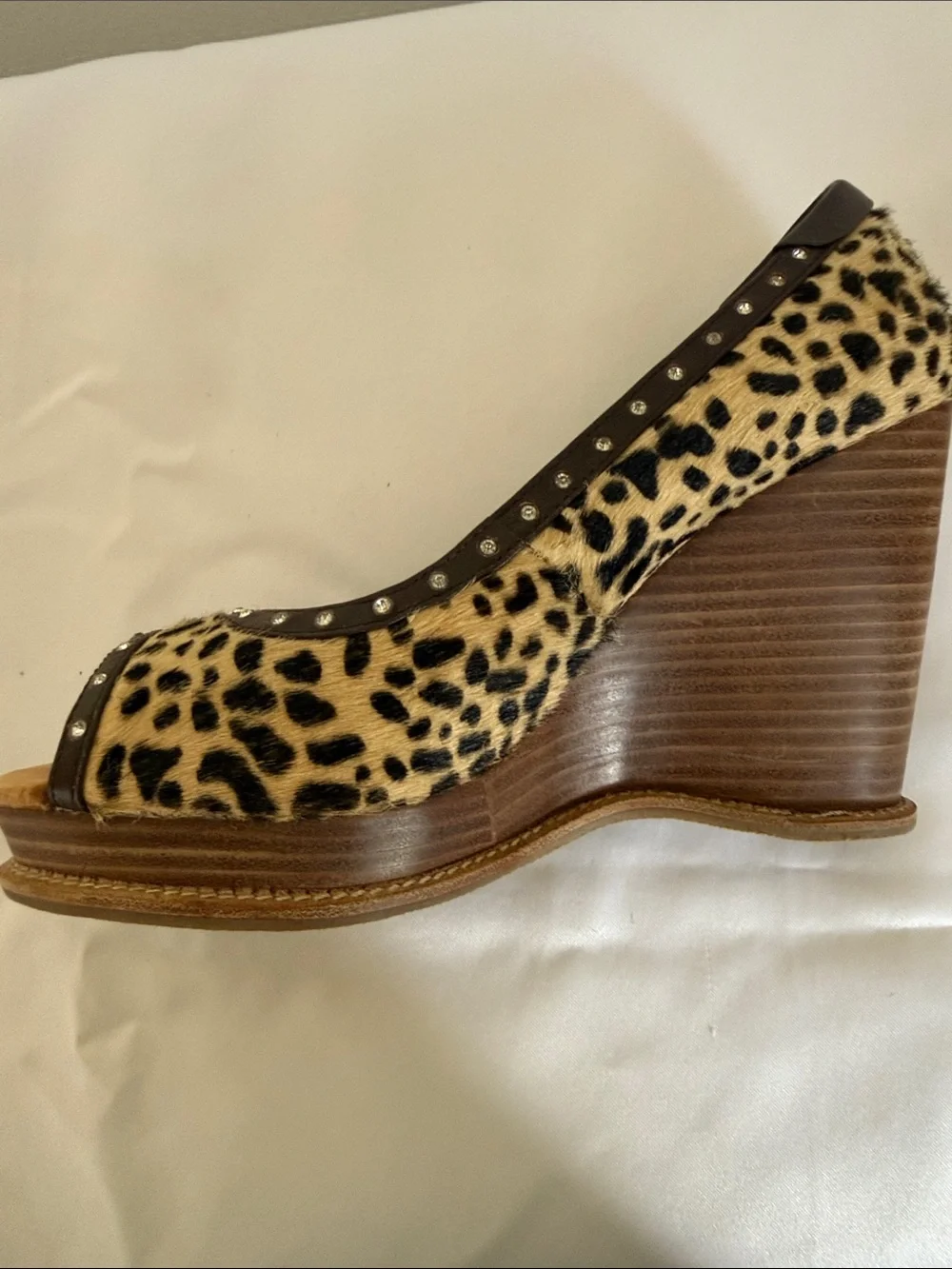 Animal print wedges with rhinestone trim. Leather upper size 8.